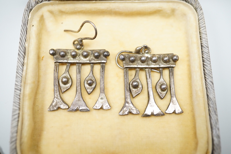 Michael Allen Bolton, a silver cross pendant and a pair of earrings, comprising: a cross pendant of textured design, length 5.1cm, British hallmarks for silver, sponsor's mark MAB, date letter for 1977, on a silver chain
